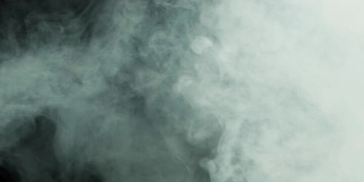 Abstract white smoke in slow motion. Smoke, Cloud of cold fog in light spot background. Light, white, fog, cloud, black background, 4k, ice smoke cloud. Floating fog.