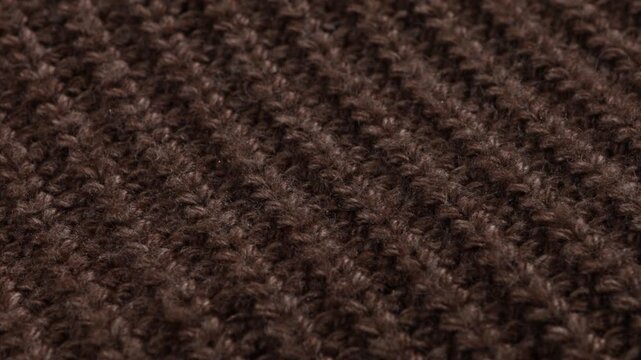 rotation woolen or cotton brown background element of winter clothing