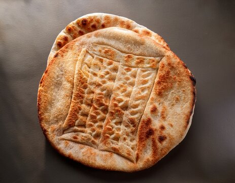 authentic traditional wheat flatbread with stamped pattern texture
