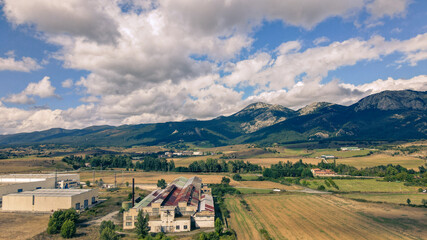 Fototapeta premium Panoramic aerial view of San Roman industrial area nestled in the lush mountains of Alava, Basque Country, Spain.