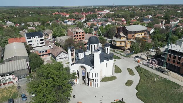 Cinematic drone orbiting around Serbian Orhodox church in the center of Vrbas, northern Serbia.