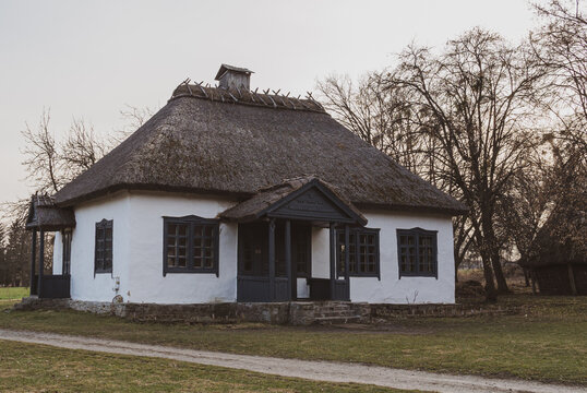 Picturesque Ukrainian folk cottage featuring unique trim and impressive thatch roof