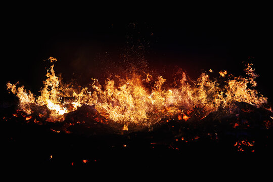 Halloween Witch . Fire embers particles over black background. Fire sparks background. Abstract dark glitter fire particles lights.