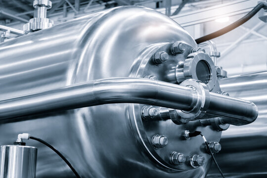 Industrial  concept. equipment of the boiler-house, - valves, tubes, pressure gauges, thermometer. Close up of manometer, pipe, flow meter, water pumps and valves of heating system in a boiler room.