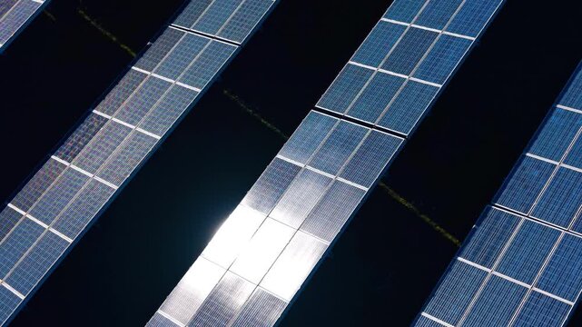 Daytime rooftop solar panels. Rows of solar panels capture sunlight on a clear day, collecting energy for use in homes or businesses.