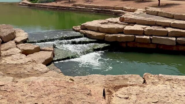 Crystal Clear Water Flowing Over Stone Steps in Wadi Hanifa