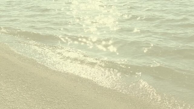 muted faded golden waters at the sandy shoreline w/twinkles & sparkles for backdrop, background, border, wallpaper - fades in and out softly, beach, sand, shore, landscape, lake, lakeside, shoreline, 