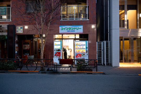 Tokyo, Japan - March 9, 2026: Quiet side street in Shibuya with narrow alley and storefronts in Tokyo, Japan.
