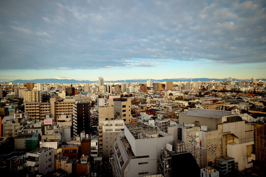 Tokyo, Japan - March 13, 2026: Mount Fuji rising above urban skyline viewed from Shibuya district in Tokyo, Japan.
