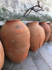 Fototapeta premium Traditional rustic Mediterranean clay jars stone patio antique terracotta pots