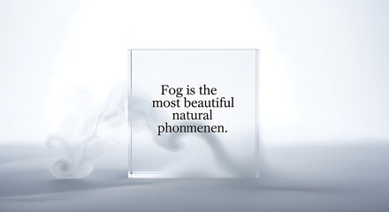 Clear glass cube with inspirational text 'This is the most beautiful natural phenomenon', soft smoke tendrils on a cool, soft light background, abstract concept