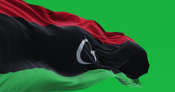 National flag of Libya waving isolated on green background. Seamless 3D render animation. Chroma key. Slow motion loop. Green screen. 4K. Selective focus
