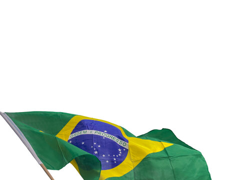 Brazilian flag cut out and isolated is waving in the wind, national symbol of Brazil with green, yellow and blue colors, representing patriotism, culture, identity and government.