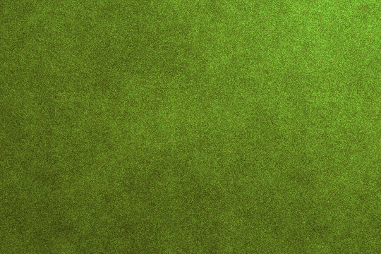 A dark green grainy background presents a rich and deep textured surface.