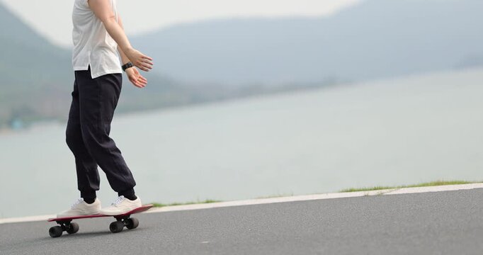 Woman skateboarding at the seaside
