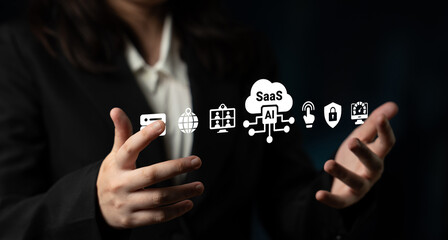 Obraz premium A business professional showcases technology applications using hand gestures, emphasizing the impact of SaaS and AI on modern industry and digital transformation. Ledger