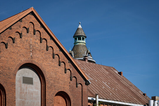 Historic Zugweg power and water station at Bonner Wall in Cologne. 19th-century red brick architecture under a clear blue sky