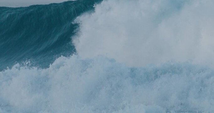 Violent ocean surge crashing water energy extreme conditions slow motion