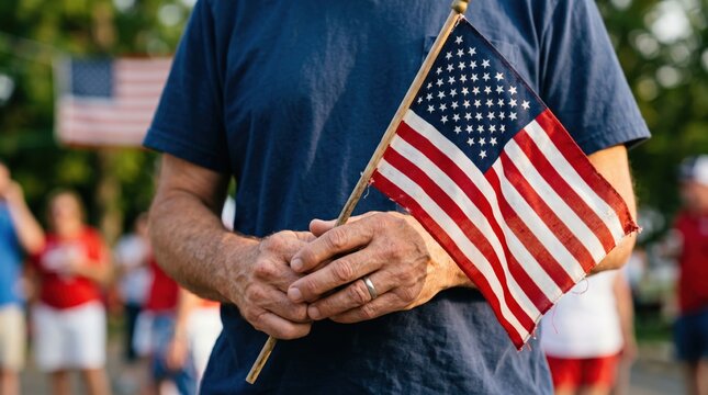Dedicated poll worker showing nonpartisan civic pride holding small flag at polling station
