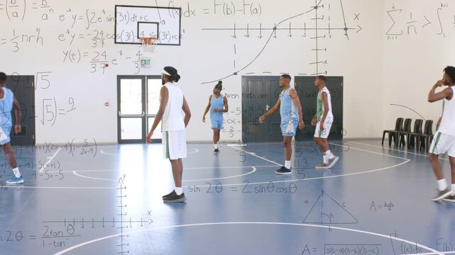 Male players running scrimmage on blue court bringing ball passing shooting scoring math wall