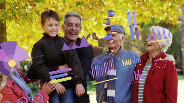 Man lifting boy for family pose while others linking shoulders, business charts overlaying group