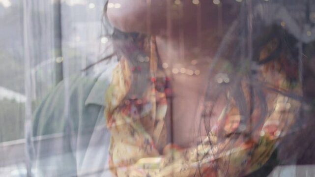 Woman musician playing guitar and singing, blending with window traffic for music