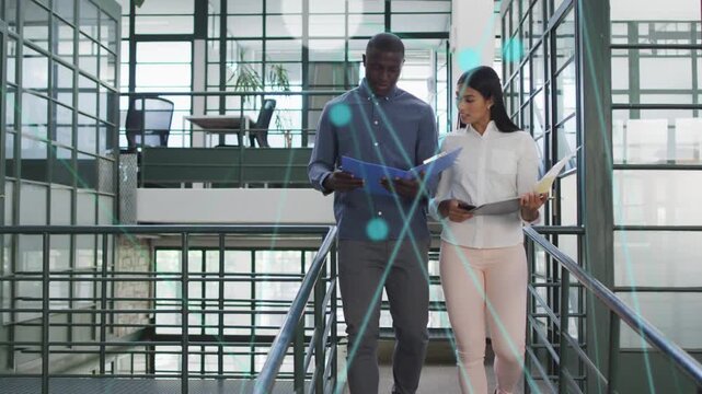 Office team descending stairs, man opening blue folder prepping, woman on phone, HUD tagging files