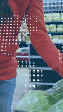 Vertical video: Buyer reaching lifting produce, checking quality while dotted globe obscuring buyer