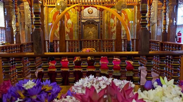 Interior shrine room at the Temple of the Sacred Tooth Relic in Kandy, Sri Lanka, places the sacred chamber housing the Tooth Relic of Lord Buddha, surrounded by devotional offerings.