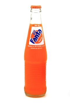 Fanta brand beverage bottle with carbonated orange flavor 