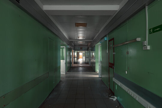 Abandoned Hospital Corridor with Green Walls