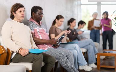 Fototapeta premium Applicants are waiting for an interview in a modern office. Recruitment process and HR processes
