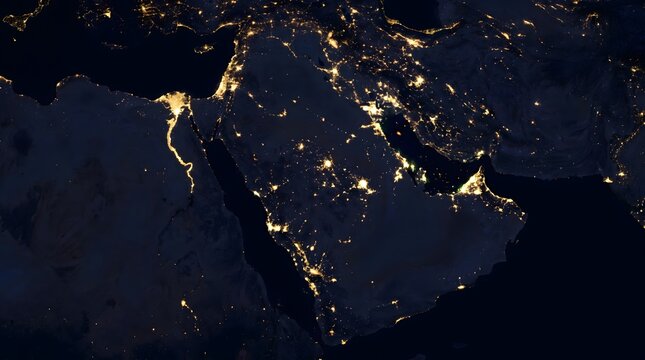 Earth at night showing Middle East with contrast between illuminated cities and dark desert regions.