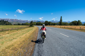 Obraz premium Cycling on a Country Road, New Zealand