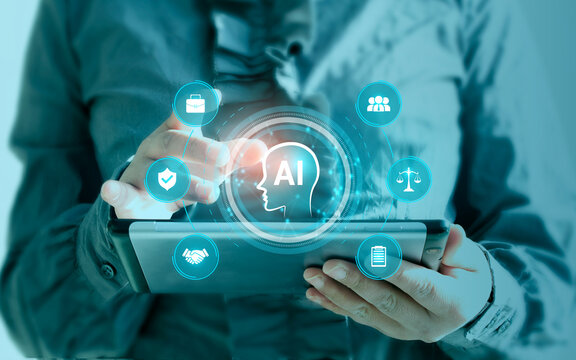 Ethics in the use of artificial intelligence. Governance and regulatory compliance for responsible, fair, and accountable use. An executive uses a smart tablet.