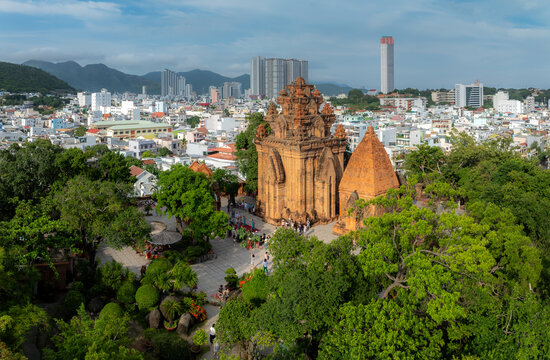 Po Nagar Cham Towers, Nha Trang, Vietnam. Tourists explore the ancient Cham architecture and lush gardens of this historic site, offering a glimpse into Vietnam's rich cultural heritage.