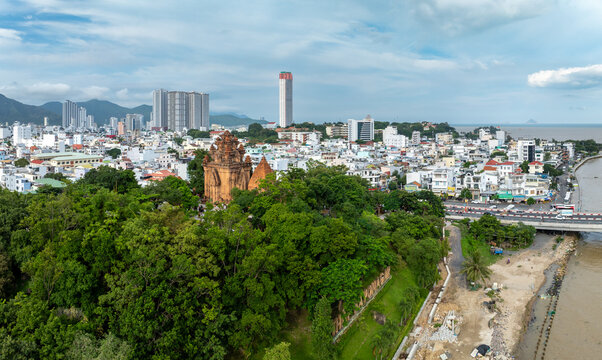Po Nagar Cham Towers, Nha Trang, Vietnam. Tourists explore the ancient Cham architecture and lush gardens of this historic site, offering a glimpse into Vietnam's rich cultural heritage.