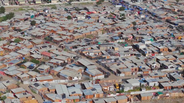 Aerial view of informal settlement in Chile with dense housing and precarious structures &ndash; urban poverty concept