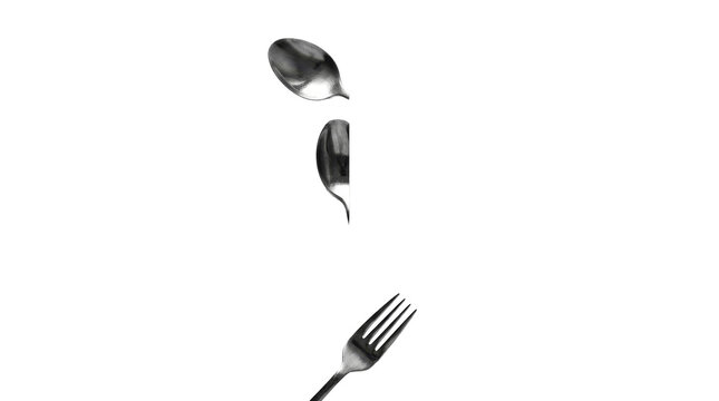 Two spoons and a fork floating on a transparent background on png background.