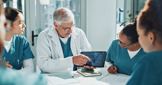 Doctor, nurse and x ray in meeting with tablet screen, training team or medical research for diagnosis. Healthcare worker, people and teaching in hospital with tech, scan or discussion for case study
