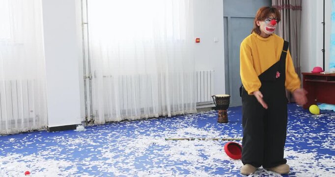 Clown actors rehearsing their performance in the rehearsal room.