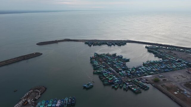 Aerial View Of Fishing Boats Docked At Harbor