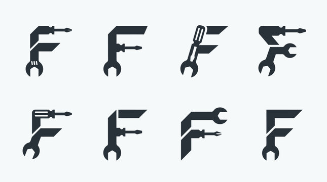 Letter F made of wrenches tools.