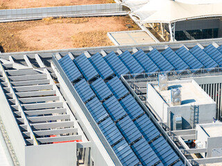 Fototapeta premium Thermal solar panels alternative technologies of water heating and photovoltaic cell in panel on roof top building