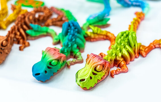 3D printer printing dragon skeleton figure close-up.