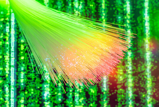 green and purple Fiber optics network cable on technology background