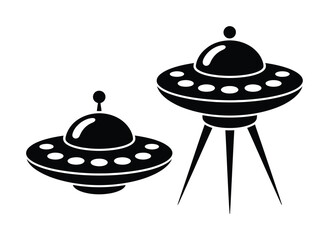 Two Black Silhouettes of Flying Saucers on a White Background © vector Art