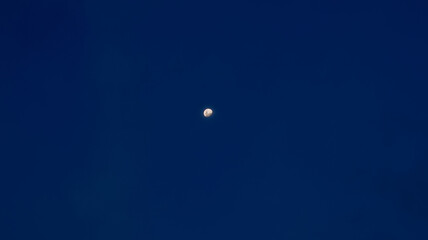 Moon in a dark blue sky © Palugada