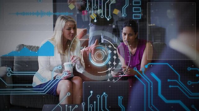 Two women leaning toward laptop, tapping phone and activating HUD, reviewing code for business