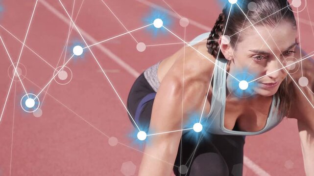 Runner holding sprinter stance on red track, blue nodes drifting across torso, mapping sports tech